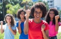 Cheering african american woman with small group of latin and caucasian girls Royalty Free Stock Photo