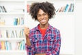 Cheering african american young adult man showing thumb up Royalty Free Stock Photo