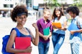 Cheering afro american female student with group of multi ethnic young adults