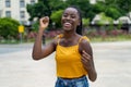 Cheering afro american female young adult enjoying life