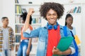 Cheering afro american male student with group of black young adults