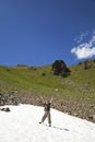 Cheering boy in a snowfield