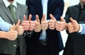 Cheering business people holding many thumbs thumbs up Royalty Free Stock Photo