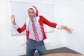 Cheering businessman in SantaÃÂ´s costume