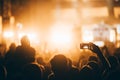 Cheering crowd at concert enjoying music performance Royalty Free Stock Photo