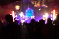 Cheering crowd at a party concert. Silhouettes of audience people at live concert stage show. Happy fan cheer musician band, nigh