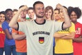 Cheering german football fan with group of other european supporters