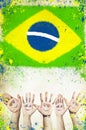 Cheering hands, and flag of Brazil