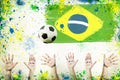 Cheering hands, soccer ball and colors of Brazil
