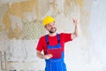 Cheering handyman after a job well done Royalty Free Stock Photo