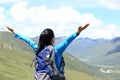 Cheering hiking woman enjoy the beautiful view at mountain peak Royalty Free Stock Photo