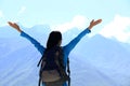 Cheering hiking woman enjoy the beautiful view at mountain peak in tibet,china Royalty Free Stock Photo