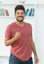 Cheering latin american man with beard and dark hair Royalty Free Stock Photo