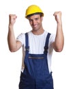 Cheering latin construction worker