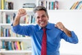 Cheering and laughing businessman with tie