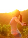 Cheering woman hiker raised arms mountain top Royalty Free Stock Photo