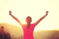 Cheering woman hiker raised arms mountain top Royalty Free Stock Photo