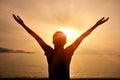 Cheering woman open arms on beach Royalty Free Stock Photo