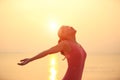 Cheering woman open arms on beach Royalty Free Stock Photo