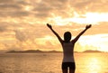 Cheering woman open arms on beach Royalty Free Stock Photo