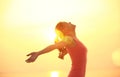 Cheering woman open arms on beach