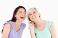 Cheering women on the phone Royalty Free Stock Photo