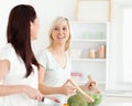 Cheering Women preparing dinner Royalty Free Stock Photo