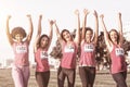 Cheering women supporting breast cancer marathon Royalty Free Stock Photo