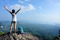 Cheering young woman hiker open arms Royalty Free Stock Photo
