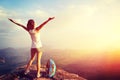 Cheering young woman hiker open arms Royalty Free Stock Photo