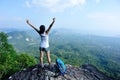 Cheering young woman hiker open arms Royalty Free Stock Photo