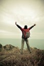 Cheering young woman hiker open arms Royalty Free Stock Photo