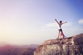 Cheering young woman hiker open arms Royalty Free Stock Photo