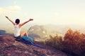 Cheering young woman hiker open arms Royalty Free Stock Photo