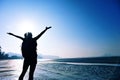 Cheering young woman hiker open arms Royalty Free Stock Photo