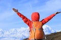 Cheering young woman hiker open arms Royalty Free Stock Photo