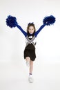 Nine year old Caucasian girl dressed in a blue cheerleader outfit Royalty Free Stock Photo