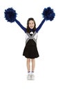 Nine year old Caucasian girl dressed in a blue cheerleader outfit Royalty Free Stock Photo