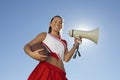 Cheerleader Holding Rugby Ball And Megaphone