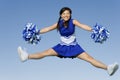 Cheerleader Jumping With Pom-Poms