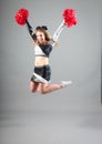 Cheerleader Jumping In Studio Royalty Free Stock Photo