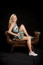 Cheerleader seated Royalty Free Stock Photo