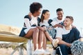 Cheerleader, sports and team on bench talking for performance, dance and motivation for game. Teamwork, dancer and Royalty Free Stock Photo