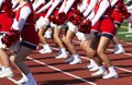 Cheerleaders cheering on the sidlines during a high school football game Royalty Free Stock Photo