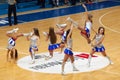 Cheerleaders dance on basketball arena