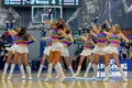 Cheerleaders are dancing on basketball court