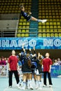 Cheerleaders girl team Lady performs acrobatics