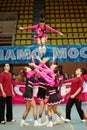 Cheerleaders girl team performs acrobatics