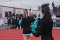 Cheerleaders at high school football game Royalty Free Stock Photo