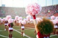 Cheerleaders with pompoms in the stadium. Cheerleader team